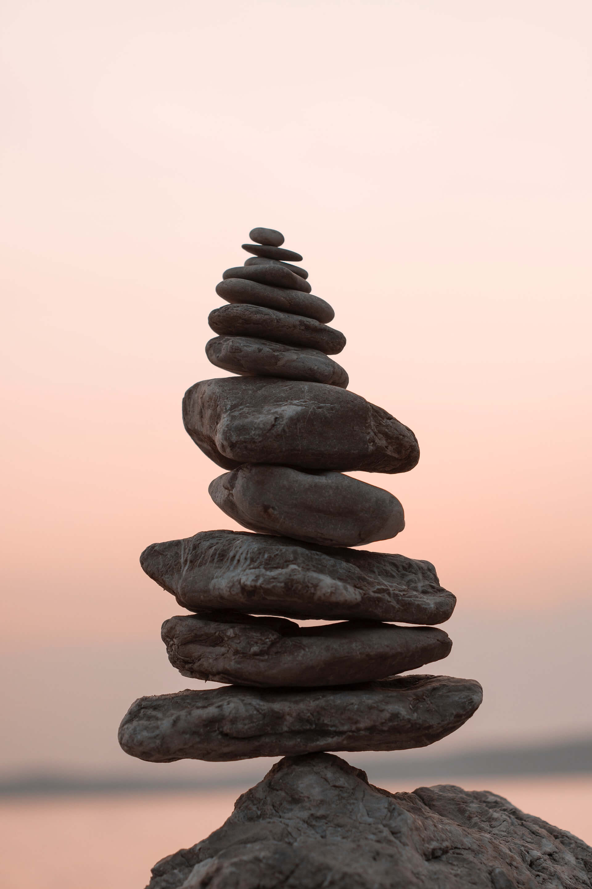 Smooth rocks balancing during sunset.